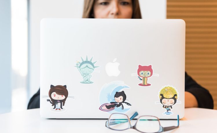 eyeglasses in front of laptop computer