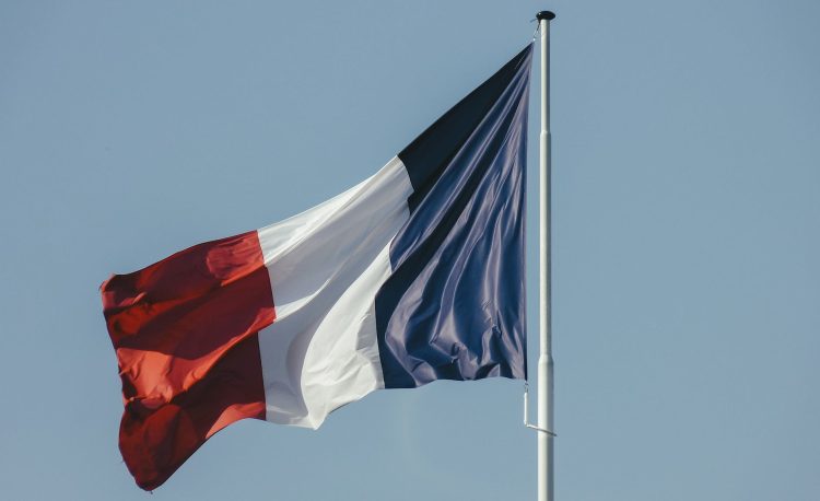 french flag against blue sky
