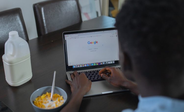 a person using google website on a laptop