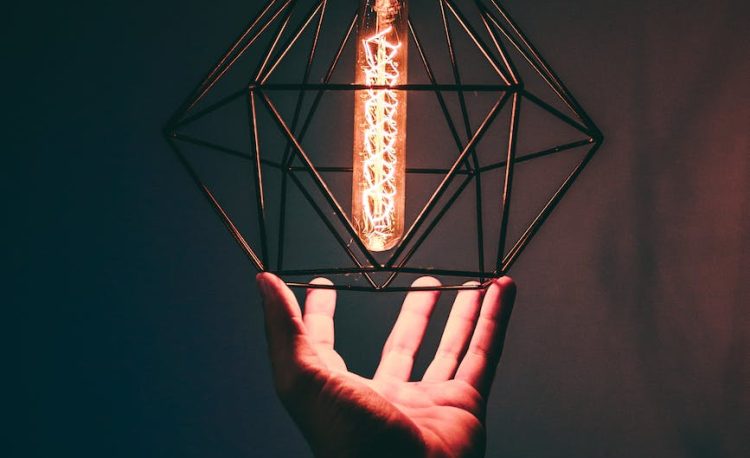 person holding pendant light