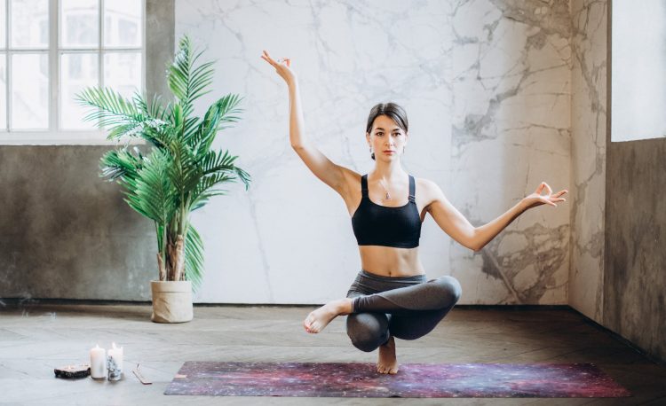 woman practicing yoga