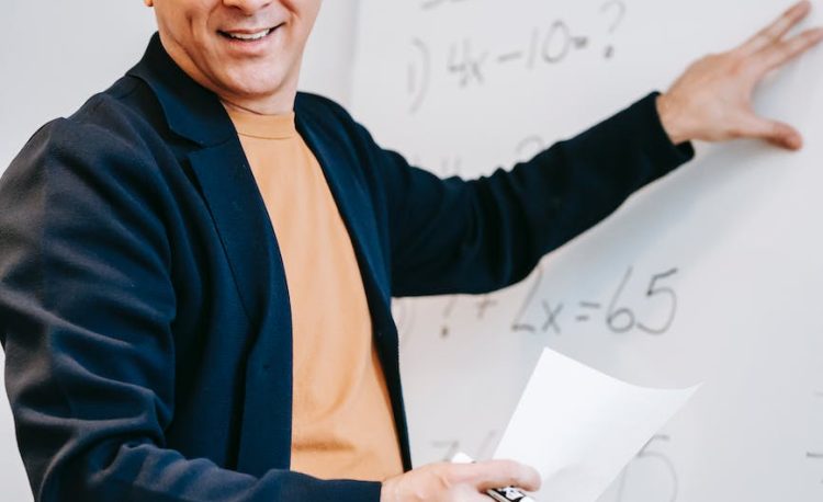 photo of man discussing on white board