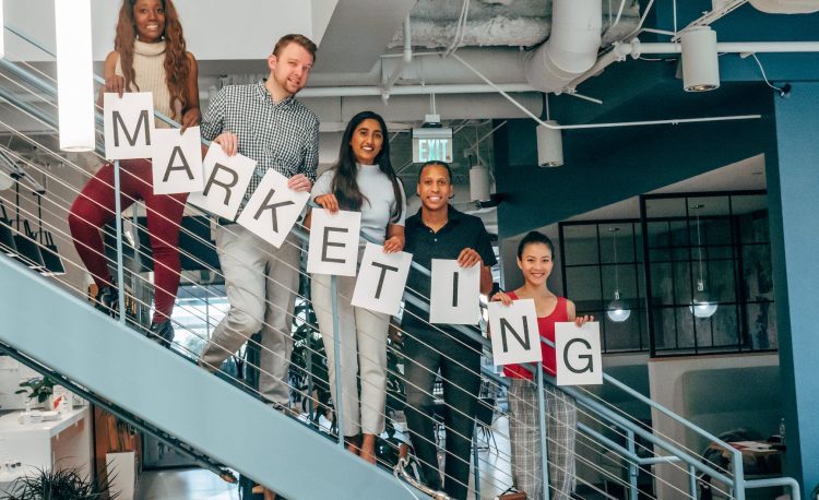 coworkers standing on a stairway