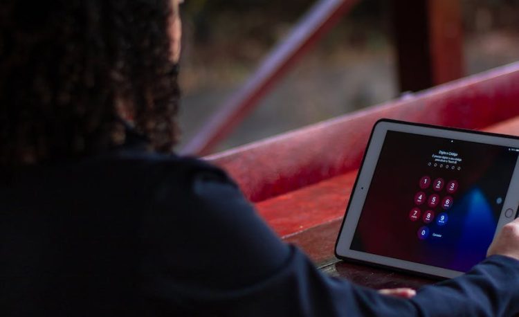 a person looking at a tablet screen with password