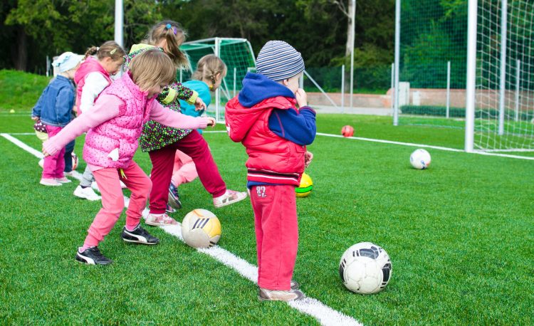 toddler playing soccer