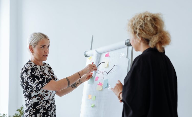 women discussing business together
