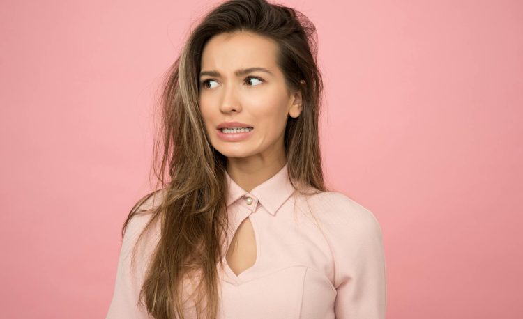 woman wearing pink top