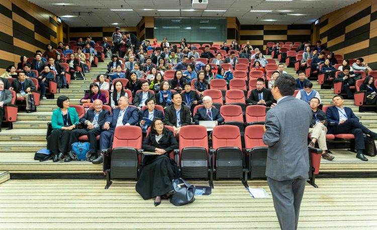 man standing in front of people