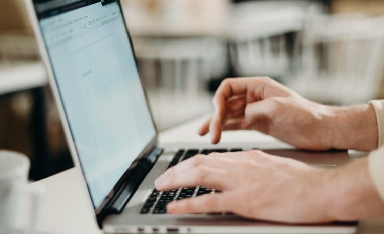 person using laptop computer