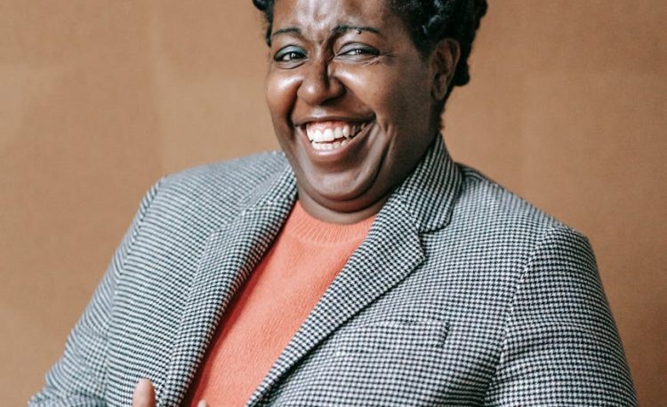 laughing formal woman in elegant jacket