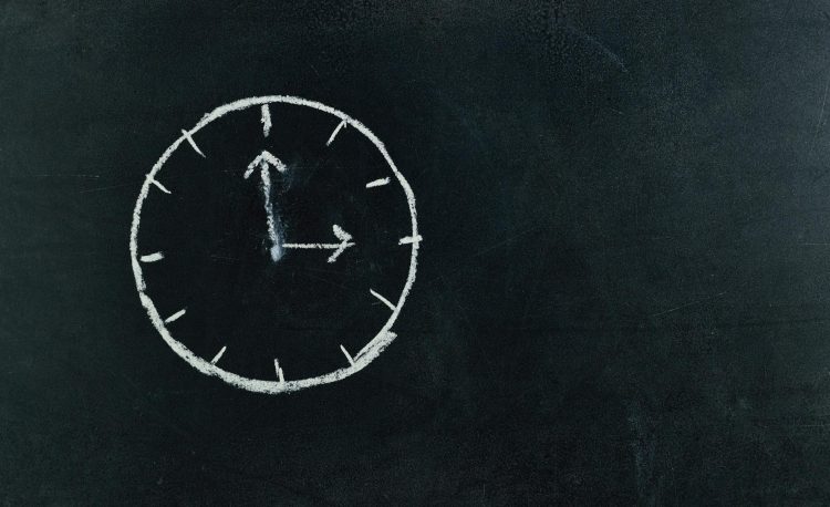 analog clock sketch in black surface